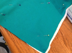 Pin front of pillow to backing fabric together.